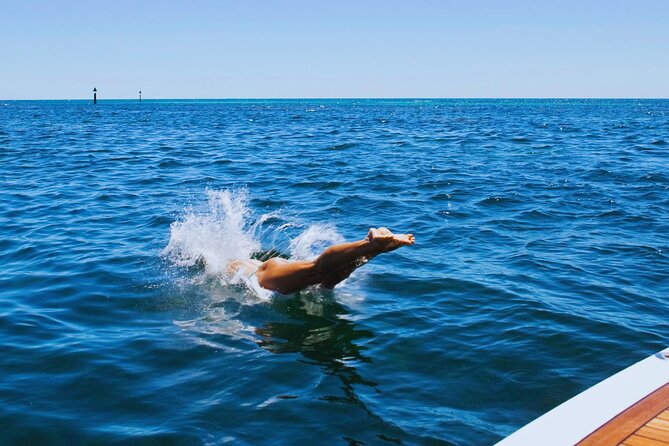 Amalfi Coast Snorkeling and Limoncello Tasting: 4h Boat Tour - Stop 1, Amalfi: sea-level views of cliffs, villas, and beach coves