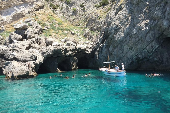 Amalfi to Capri Private Boat Tour - Capri from the sea: Faraglioni, grotto areas, and the rock hole cruise-by