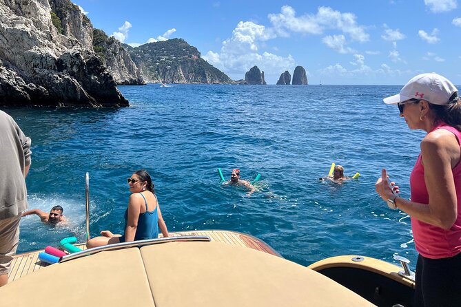 Capri All Inclusive Semi-Private Boat Tour with City Visit - Marina Grande and Bagni di Tiberio, start with the easy beach wins