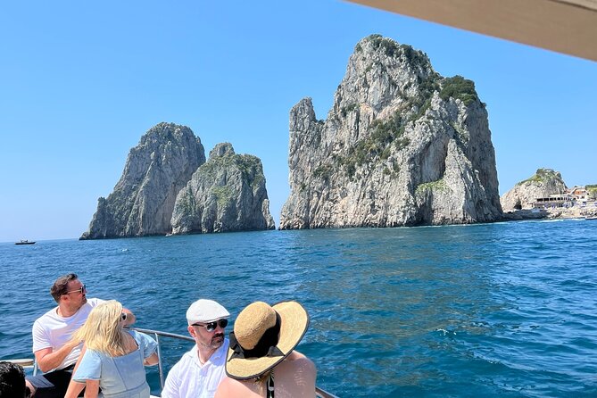 Capri, Blue Grotto by Priority, Faraglioni Swim and City Visit - Punta Ventroso: the onboard break with dips, music, and drinks