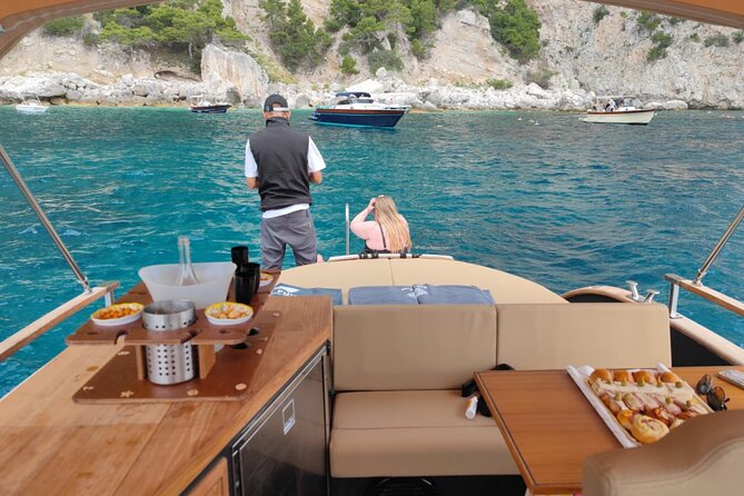 Capri Signature Boat Tour from Amalfi with Time on Land - Faraglioni and Casa Malaparte: Capri’s star attractions from the water