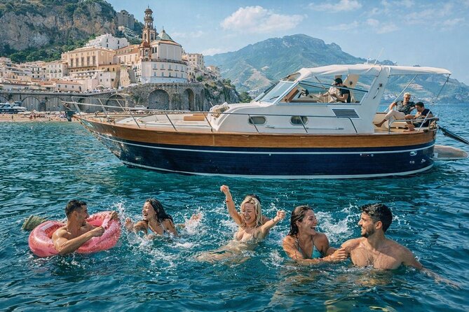 Luxury Amalfi Coast Boat Tour with Swim & Prosecco – Small Group - Amalfi Coast Views: Natural Arch and Cliff-Edge Time