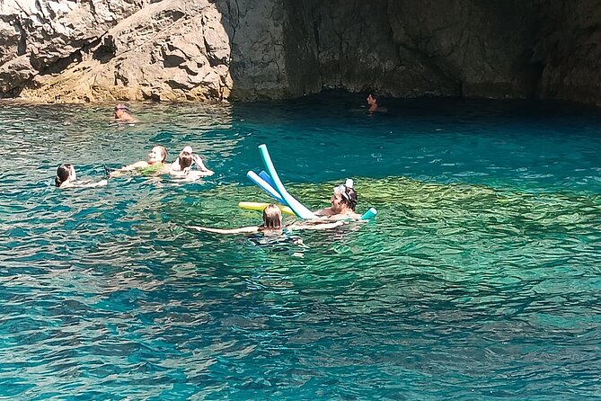 Private Amalfi Coast and Capri boat tour - Full Day Swim and Fun - Capri approach: White Grotta and Faraglioni photo time