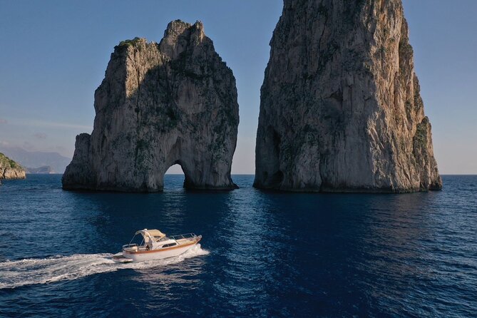 Private Boat Tour Capri-Blue Grotto - All-inclusive price - Coves and lighthouse views: Cala del Rio, Cala del Limmo, and Punta Carena