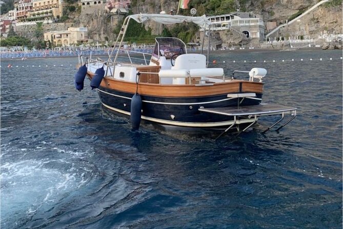 Private Boat Tour from Positano to the Amalfi Coast with Drinks - Cruising from Positano toward Praiano, with Tritone grottos swim time